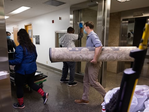 Senate staffers move office decorations on Tuesday, Nov. 23, 2021.