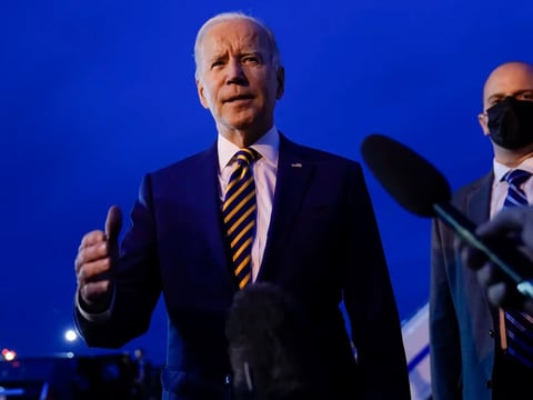President Biden speaks to members of the media before boarding Air Force One in Minneapolis on Tuesday. Biden is set on Thursday to discuss his strategy for dealing with COVID-19 this winter.