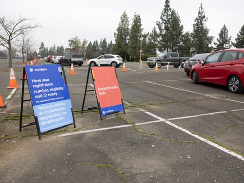 People line up in cars at Cal Expo to take COVID-19 tests on Thursday, Jan. 6, 2022.