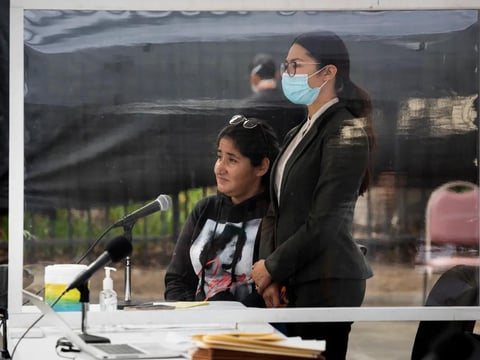 Desiree Garibay listens to the judge at homeless court in Redondo Beach on April 27, 2022.