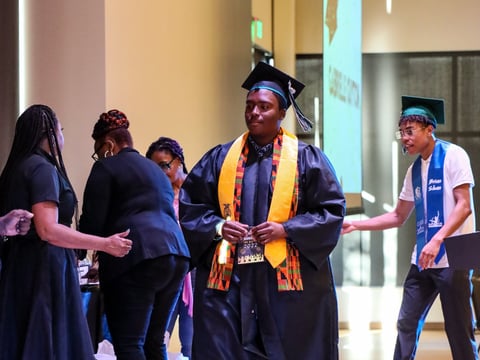 High School graduate Terrance Jackson walks across the stage at Black Graduation.