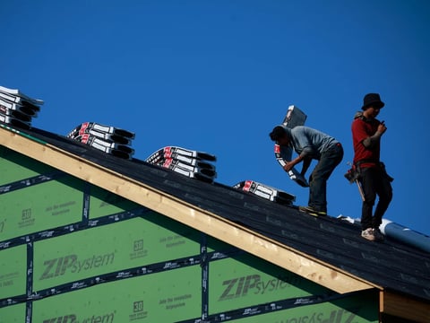 Contractors work on the roof of a house under construction in Louisville, Ky. A new study shows the U.S. is 3.8 million homes short of meeting housing needs.