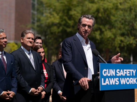 Gov. Gavin Newsom speaks during a news conference as he is joined by California Attorney General Rob Bonta, left, and state Sen. Bob Hertzberg Friday, July 22, 2022. Newsom signed a gun control law Friday.