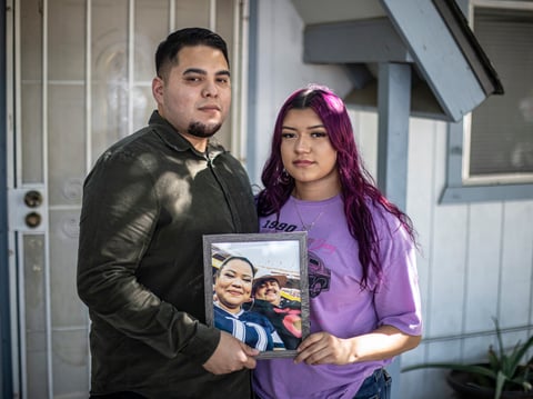 Martin (left) and Miranda Basulto, who lost both of their parents to COVID, pose for a photo in front of their home in Coalinga on June 28, 2022. Miranda is eligible for a state bond given to kids who lost a caregiver (or both) because of COVID.