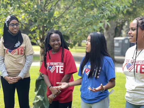 Jennifer Hernandez (in blue) getting out the vote as part of her work with the MLK Freedom Center.