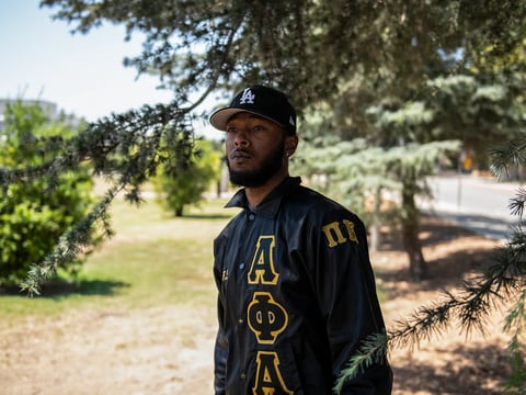 Christopher Carter, 22, a fifth-year communications student at Cal State Northridge, stands for a portrait at CSUN in Northridge on August 19, 2022. “I want the world to know that as a young Black man, you can achieve big things in life,” Carter said