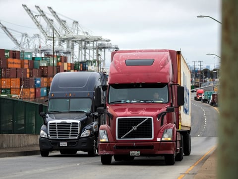 Shipments of cargo leave the Port of Oakland on July 25, 2022. California is scaling up efforts to ban diesel trucks and phase in zero-emission trucks.