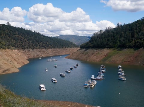 Houseboats sit in the drought lowered waters of Oroville Lake, near Oroville, Calif., Tuesday, April 19, 2022.