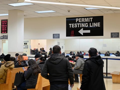 People wait at the New York State Department of Motor Vehicles office at Atlantic Center in the Brooklyn borough of New York on December 18, 2019.