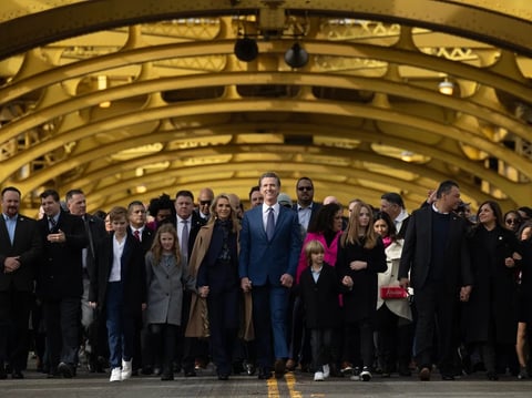 Gov. Gavin Newsom marches with a group of supporters towards the state Capitol for his second inauguration on Jan. 6, 2023.