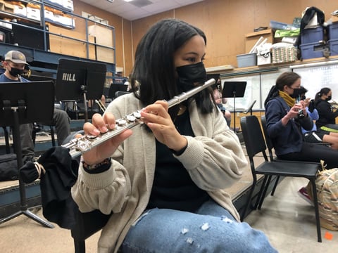 A student plays the flute while wearing a protective face mask during a music class at the Sinaloa Middle School in Novato, Calif., Tuesday, March 2, 2021.