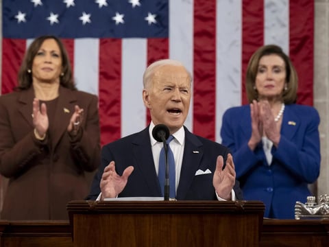 President Biden delivers the State of the Union address as U.S. Vice President Kamala Harris (L) and House Speaker Nancy Pelosi (D-CA) look on last March.