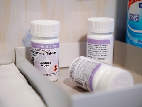 Bottles of the drug misoprostol sit on a table on March 15, 2022. Misoprostol is used as the second step in a medication abortion.