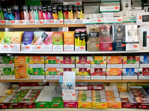 Shelves full of flavored tobacco products including disposable e-cigarettes, pipe tobacco and shisha at a smoke shop in Berkeley.