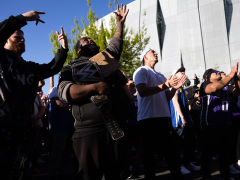 Fans gather outside the Golden 1 Center on Saturday, April 15, 2023 to watch the first Kings playoff game in 16 seasons on a screen over L Street in Downtown Sacramento, Calif.