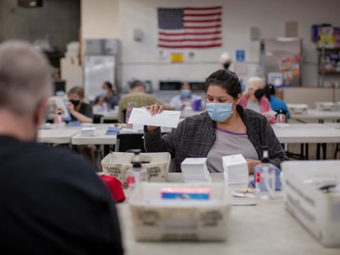 VistAbility worker Karla Marquez packs envelopes with BART Clipper card information while working at VistAbility in Concord on April 27, 2023. VistAbility employs and trains people with developmental disabilities.
