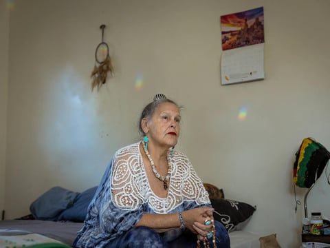 Bonnie Metcalf meditates at her Sacramento home on July 20, 2023. Metcalf suffers from sarcoidosis, an inflammatory disease, and takes cannabis products to ease the pain.
