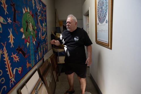 Art Luna walks through a hallway in his cafe, Luna's Cafe and Juice Bar, in Sacramento, Calif, on Thurs., July 27, 2023.