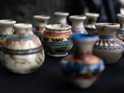 A vendor sells pottery items at the California Native American Day celebration at the state Capitol on Sept. 22, 2023.