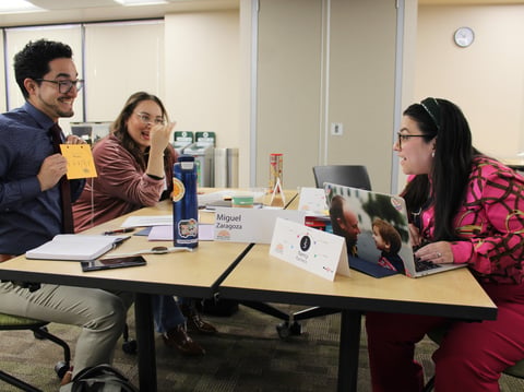Miguel Zaragoza (left), Lilia Contreras (back left) and Nancy Pacheco (right) discuss their negotiation styles in Sacramento, Calif., on Dec. 1, 2023. They are fellows in the Nueva Epoca program.