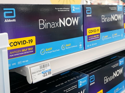 Boxes of BinaxNow home COVID-19 tests made by Abbott are shown for sale Monday, Nov. 15, 2021, at a CVS store in Lakewood, Wash., south of Seattle.