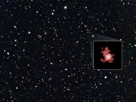 This image shows a 'close-up' of the galaxy GN-z11 as imaged by the Hubble Space Telescope, superimposed on top of another image marking the galaxy's location in the sky.