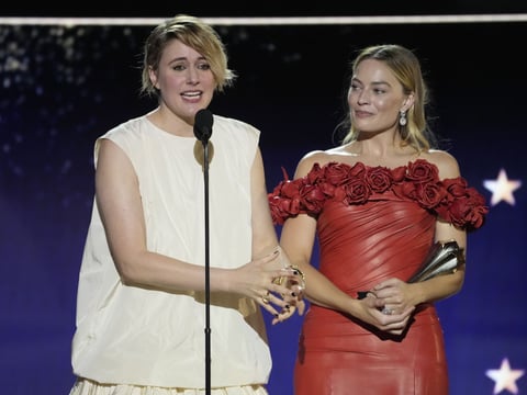 Greta Gerwig, left, and Margot Robbie accept the award for best comedy for "Barbie" during the 29th Critics Choice Awards on Sunday, Jan. 14, 2024, at the Barker Hangar in Santa Monica, Calif.