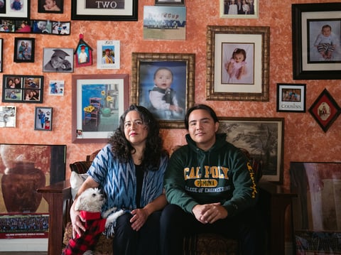 Myrna Aguilar and her son, David Thornton, pose for a portrait at their home in Los Angeles. Thornton applied for a pell grant last year, but did not qualify this academic year even though their income hasn't changed.