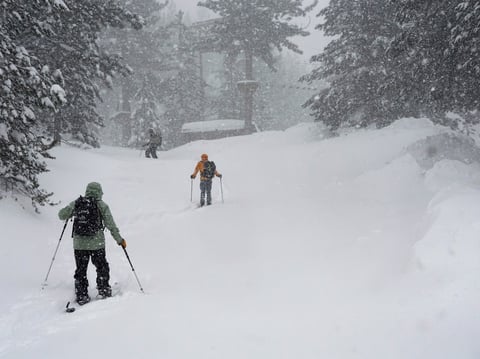 People ski during a snow storm, Sunday, March 3, 2024, in Olympic Valley, Calif.