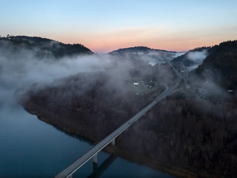In this aerial image taken from a drone, the city of Klamath, Calif., home of the tribal headquarters for the Yurok Tribe, dots the side of U.S. Highway 101 at sunrise on Jan. 21, 2022.