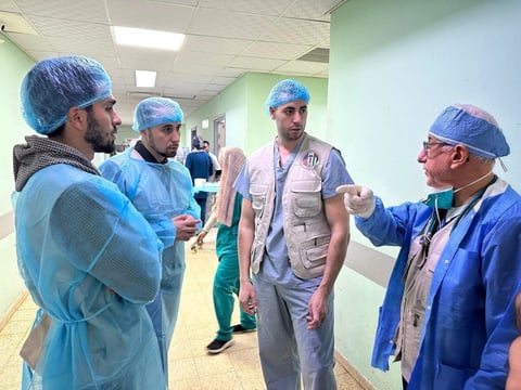 Dr. Yousef Khelfa with hospital staff in Gaza in February 2024