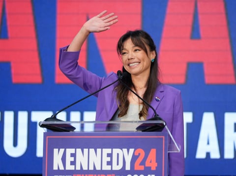 Nicole Shanahan waves from the podium during a campaign event for Presidential candidate Robert F. Kennedy Jr., Tuesday, March 26, 2024, in Oakland, Calif. Shanahan has been picked as Kennedy Jr.'s running mate.