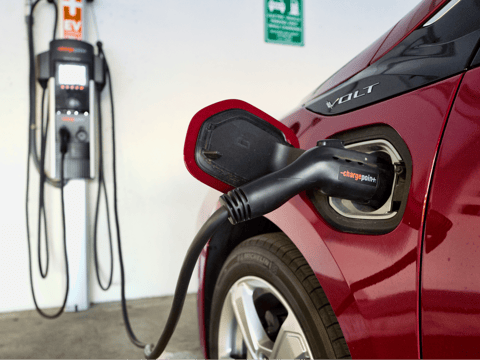 A Chevrolet Volt hybrid car is seen charging at a ChargePoint charging station at a parking garage in Los Angeles, Oct. 17, 2018.