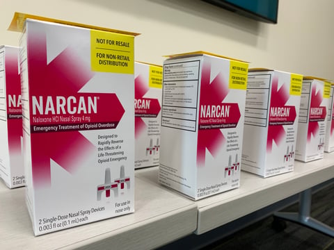 Boxes of Narcan, devices which carry the opioid-overdose antidote naloxone, are stacked on a table at Sacramento State on April 4, 2024.