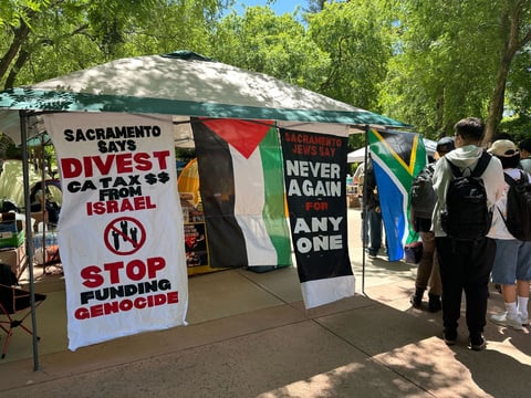 Students protesting the war in Gaza and calling for the university to divest from companies tied to it gather at the Sacramento State library quad on Monday, April 29, 2024.