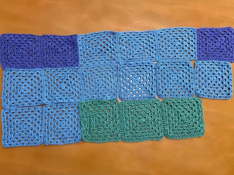 Crochet granny squares representing January, February, March and April's average temperatures in Sacramento, produced as part of CapRadio's temperature blanket.