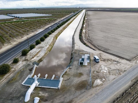In this aerial drone photo provided by the California Department of Water Resources, the primary pump in the foreground is part of a groundwater recharge project which captures excess flow for groundwater storage in Fresno County on March 13, 2023.
