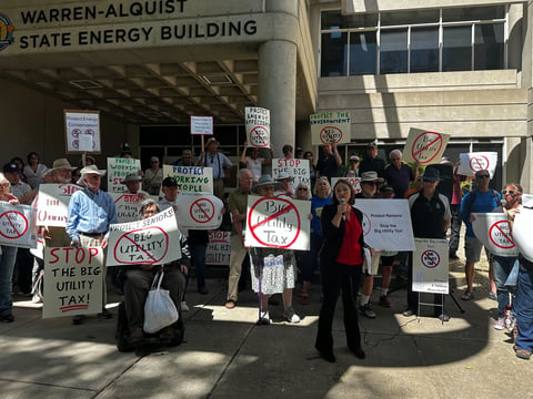 Groups organized in Sacramento outside the Warren-Alquist State Energy Building to protest the new charge on May 9, 2024.