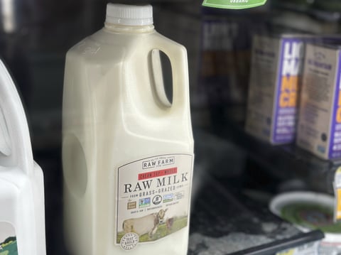 A bottle of raw milk is displayed for sale at a store in Temecula, Calif., on Wednesday, May 8, 2024.
