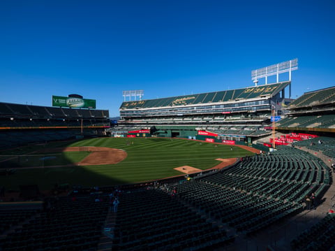Fans walk to their seats before the start of a baseball game, April 2, 2024, in Oakland, Calif.