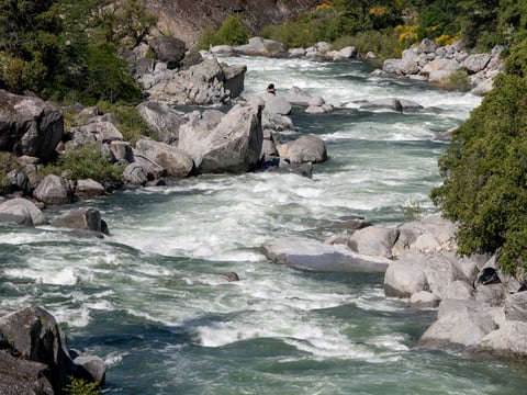 Fast-moving waters from the South Yuba River flows under the old 49 Highway bridge in Nevada City on June 9, 2023.