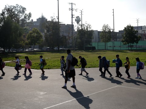 A group of students walk back to their classroom after finishing their afternoon snack at Kingsley Elementary School Tuesday, Jan. 13, 2015, in Los Angeles.