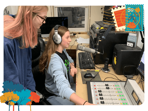 Student DJs Elizabeth Ramirez and Tori Norlie (DJ T) prepare for a live radio break.