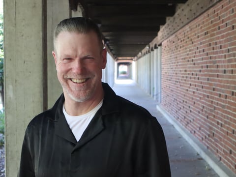 David Cable stands in the halls of Sacramento City College on June 5. Cable was one of the first cohorts of the PREP program when it was introduced at Mule Creek State Prison in 2016. He said professor Kalinda Jones changed his life.