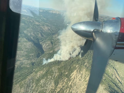A plume of smoke appears as the Royal Fire burns 12 miles southwest of Truckee.