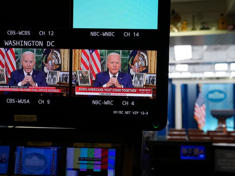 President Joe Biden can be seen on monitors in the press briefing room of the White in Washington, Sunday, July 14, 2024, as he addresses the nation from the Oval Office on the assassination attempt of former President Donald Trump.