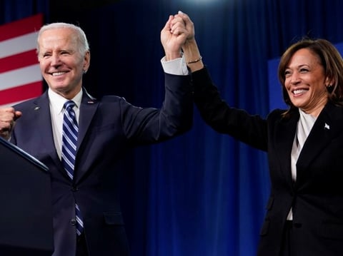 President Biden and Vice President Harris stand on stage at the Democratic National Committee winter meeting, Feb. 3, 2023, in Philadelphia.