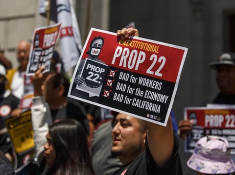 Ride-share drivers of the California Gig Workers Union at a press conference outside the Supreme Court of California in San Francisco on May 21, 2024.