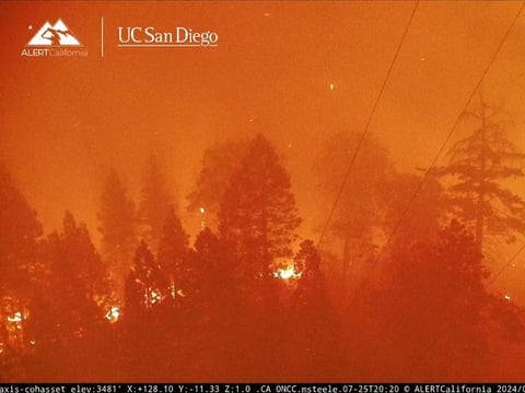 The Park Fire burns near the NSPR transmission tower in Cohasset, Calif. on July 25, 2024.