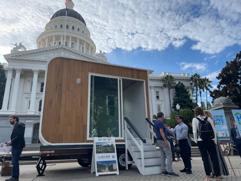 Boss Cubez tiny homes appear outside of the California state Capitol in August 2024.